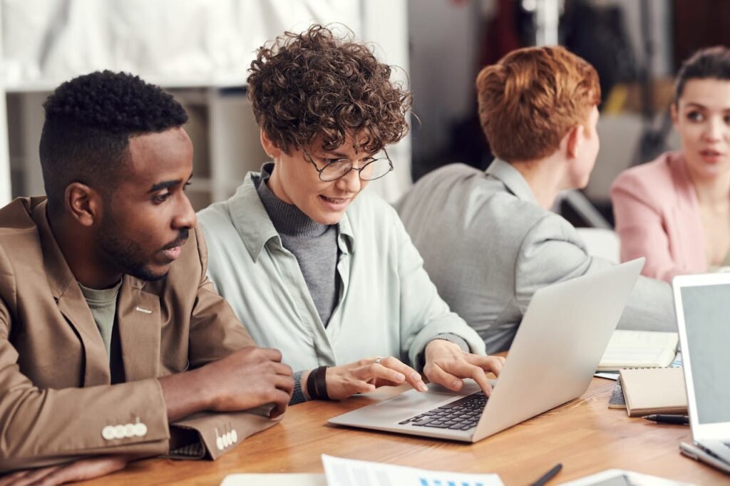 Photo Of People Looking On Laptop